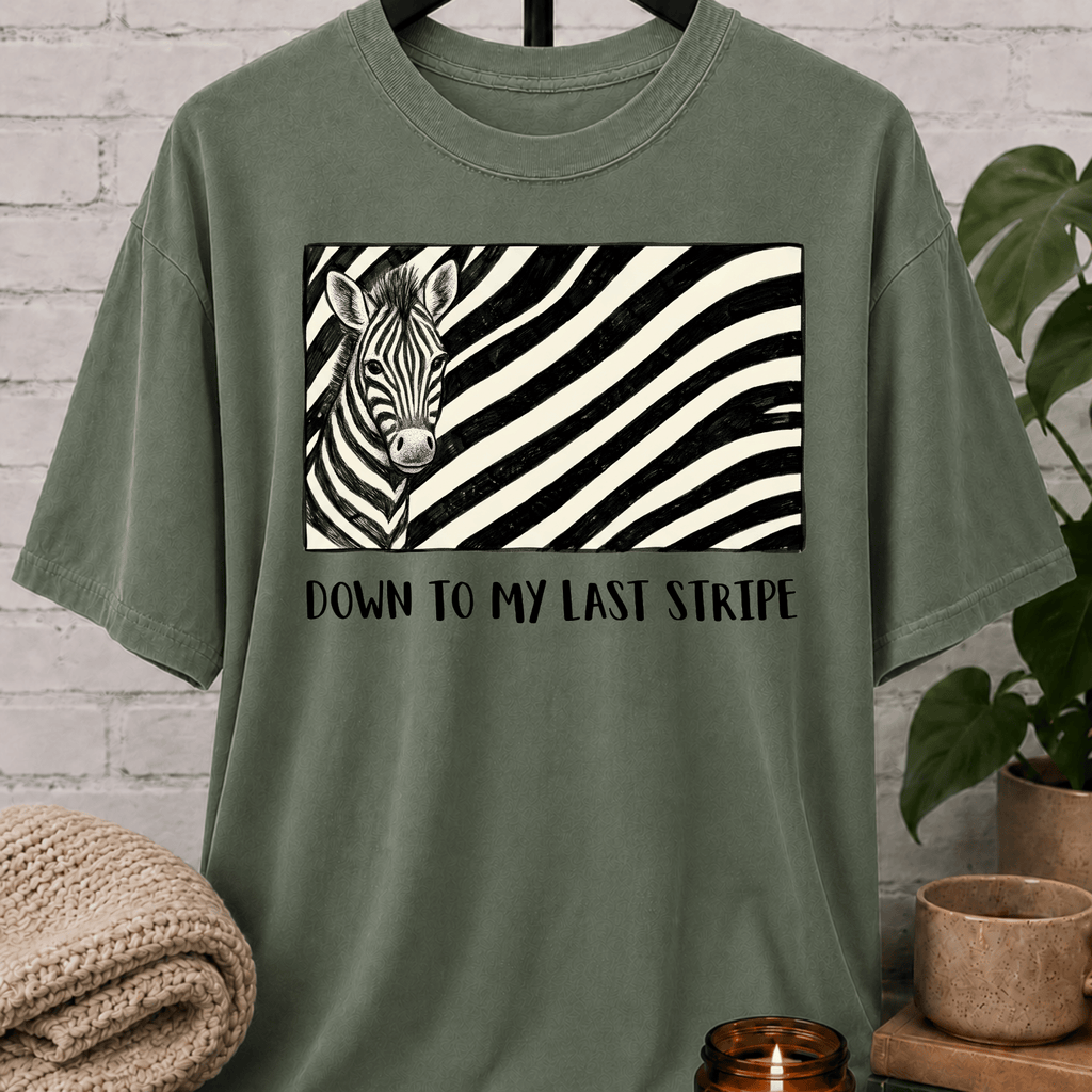 Funny zebra graphic T-shirt featuring a black and white zebra illustration with bold zebra stripes and the phrase “Down to My Last Stripe,” a sarcastic overwhelmed humor shirt for overthinkers and animal lovers.