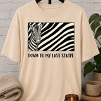 Funny zebra graphic T-shirt featuring a black and white zebra illustration with bold zebra stripes and the phrase “Down to My Last Stripe,” a sarcastic overwhelmed humor shirt for overthinkers and animal lovers.