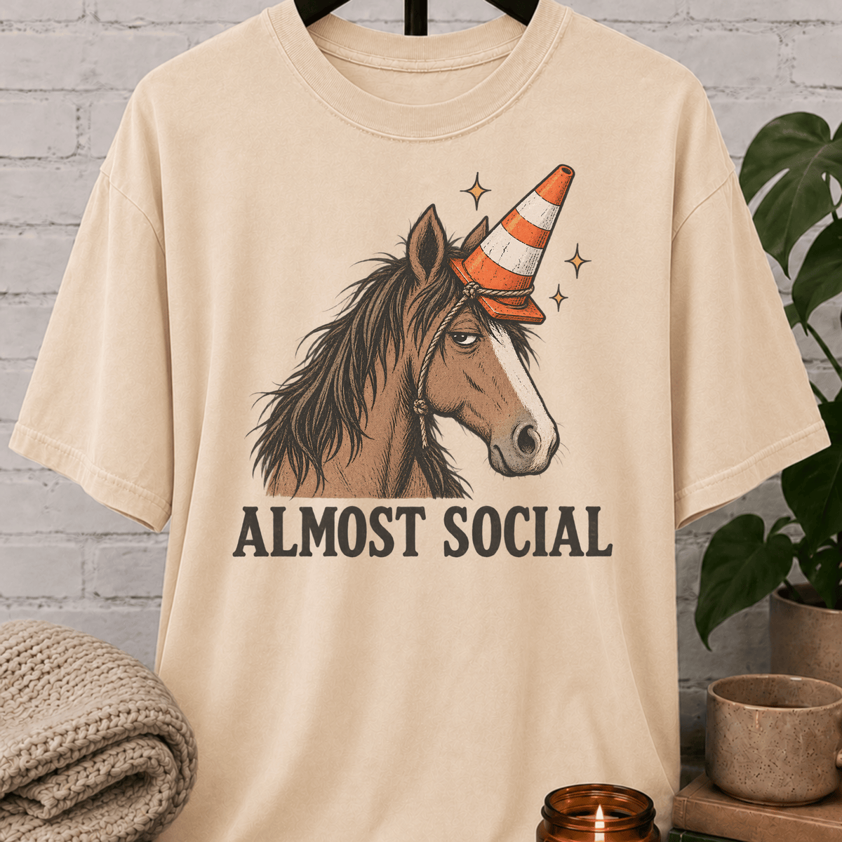 Funny horse introvert T-shirt featuring an unimpressed horse wearing an orange traffic cone with the phrase “Almost Social,” a quirky graphic tee for socially awkward homebodies and low social battery humor fans.