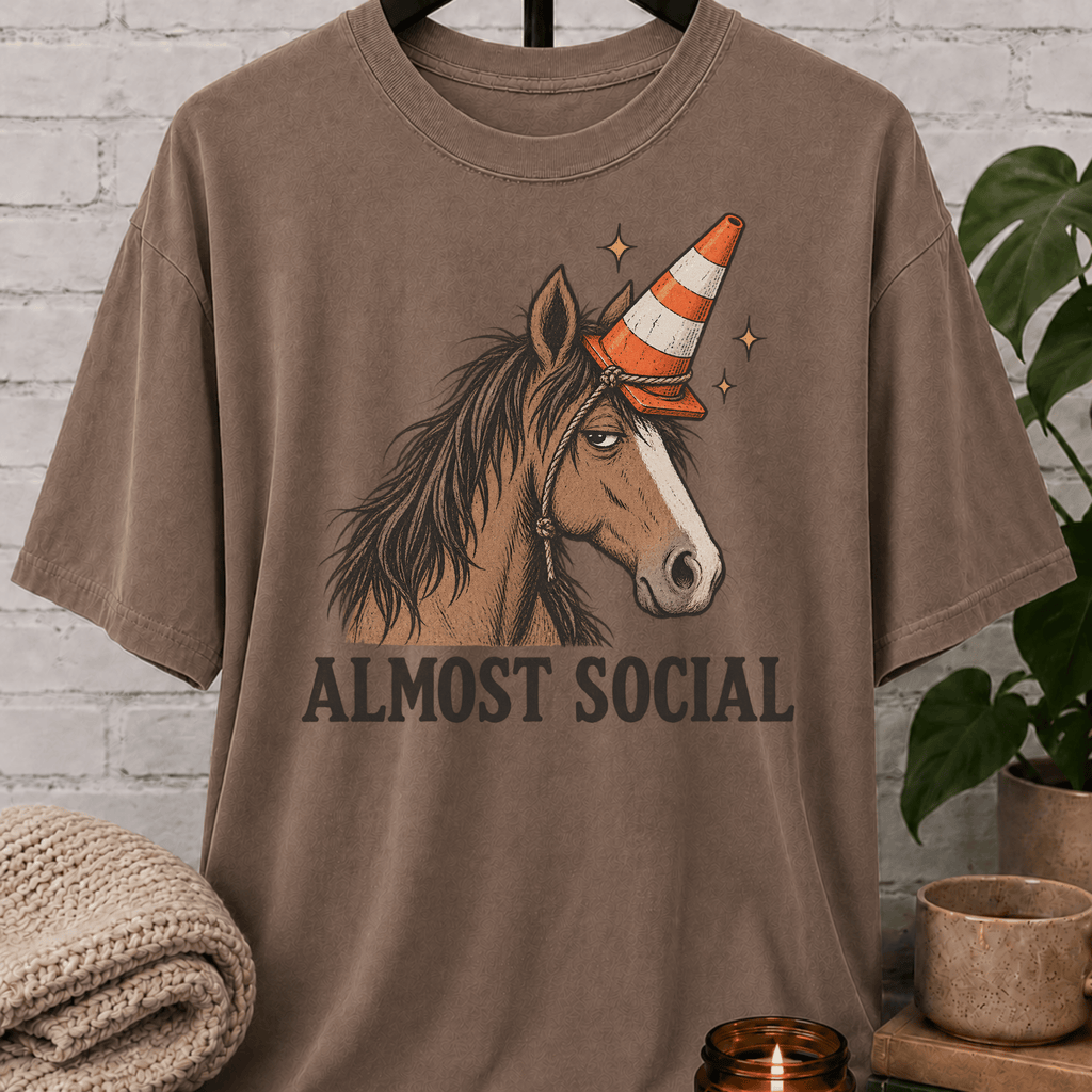 Funny horse introvert T-shirt featuring an unimpressed horse wearing an orange traffic cone with the phrase “Almost Social,” a quirky graphic tee for socially awkward homebodies and low social battery humor fans.
