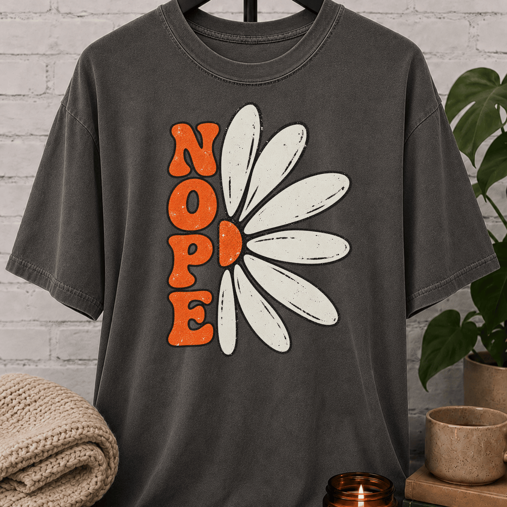 Sarcastic flower T-shirt featuring a retro daisy graphic with the word “NOPE,” a funny antisocial floral graphic tee for introverts, homebodies, loners, and socially selective humor fans.