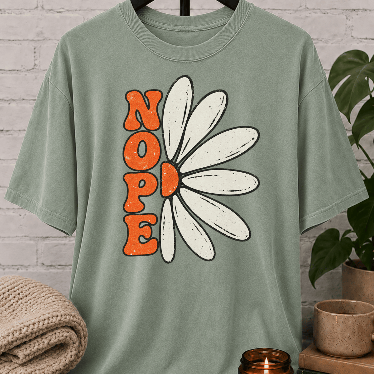 Sarcastic flower T-shirt featuring a retro daisy graphic with the word “NOPE,” a funny antisocial floral graphic tee for introverts, homebodies, loners, and socially selective humor fans.
