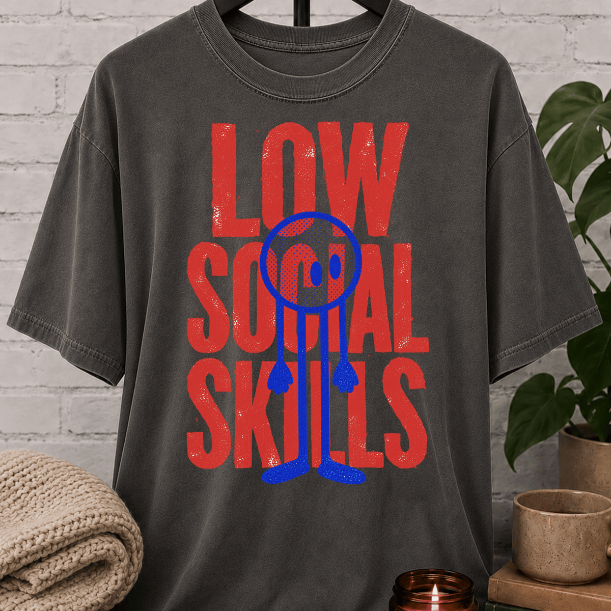 Low Social Skills graphic T-shirt featuring a distressed deadpan face design, a funny socially awkward shirt for awkward humor fans and people who avoid unnecessary socializing.