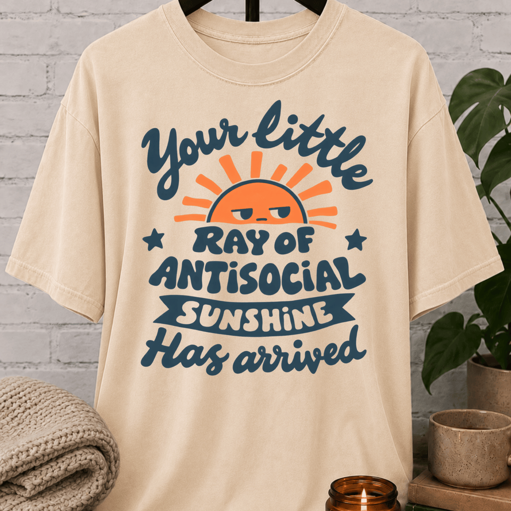 Funny antisocial T-shirt featuring an unimpressed retro sun and the phrase “Your Little Ray of Antisocial Sunshine Has Arrived,” a sarcastic graphic tee for socially selective and people-averse humor fans.