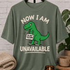 Funny dinosaur T-shirt featuring a green T-rex holding a “Do Not Disturb” sign with the phrase “Now I Am Unavailable,” a sarcastic loner graphic tee for hermits, socially unavailable types, and personal space humor fans.