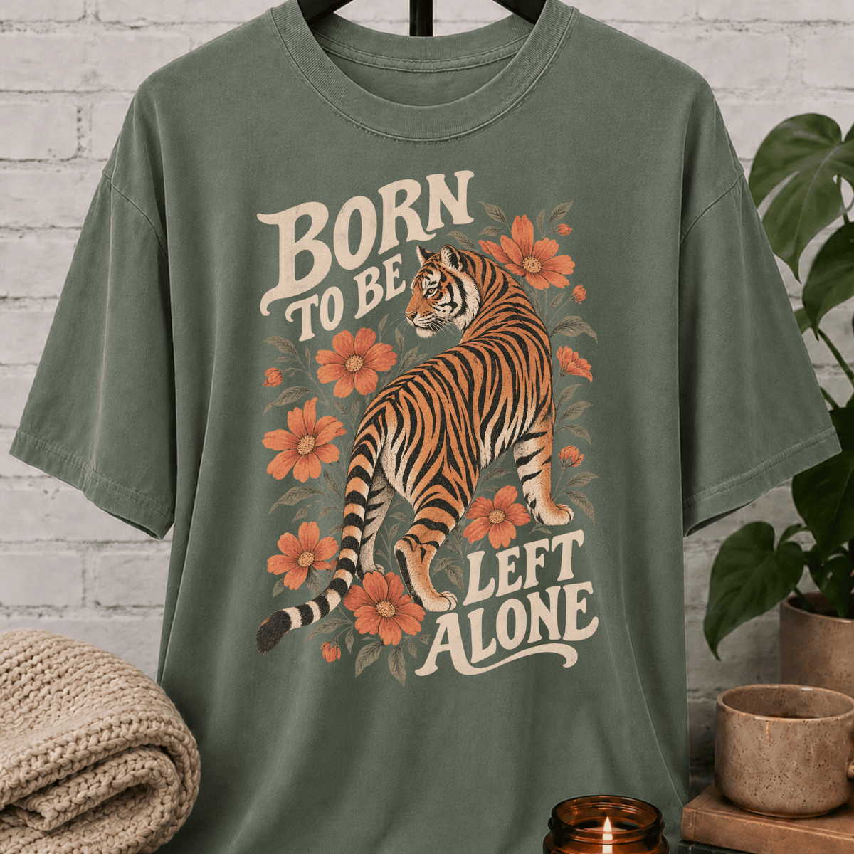 Antisocial tiger graphic T-shirt featuring a vintage floral tiger illustration and the phrase “Born to Be Left Alone,” a funny loner shirt for introverts, solitude lovers, and people who prefer their own company.
