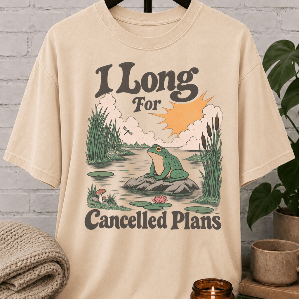 Funny cancelled plans frog T-shirt featuring a vintage pond scene with a frog and the phrase “I Long For Cancelled Plans,” a socially selective graphic tee for chronic cancellers and solitude lovers.