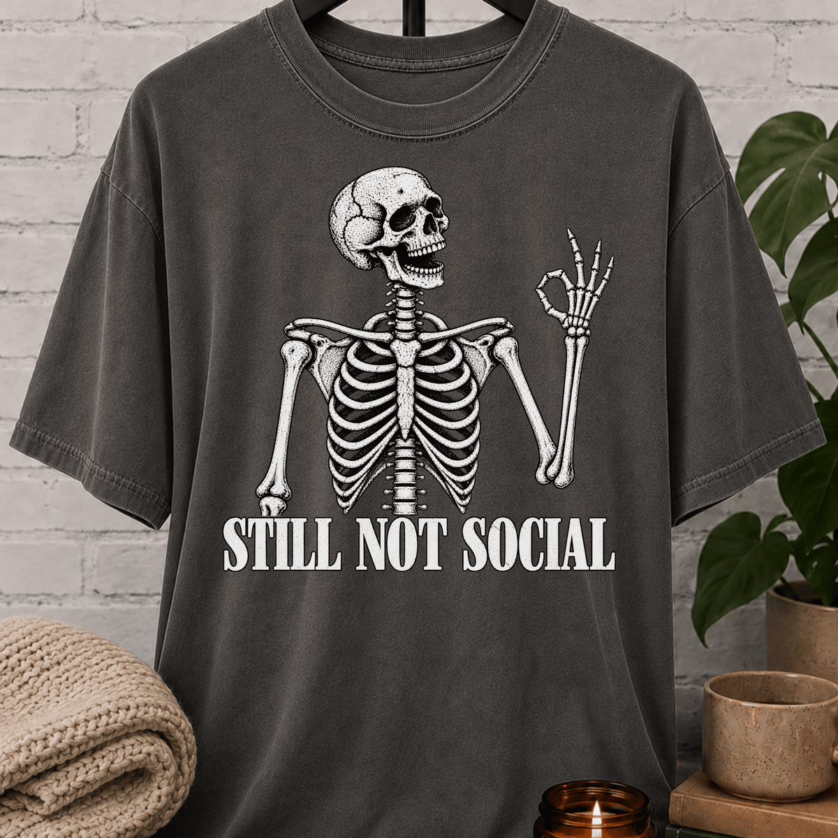 Funny skeleton T-shirt featuring a vintage skeleton graphic with the phrase “Still Not Social,” a low social battery shirt for loners, people-avoiders, and fans of sarcastic social humor.