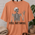 Funny skeleton T-shirt featuring a vintage skeleton graphic with the phrase “Still Not Social,” a low social battery shirt for loners, people-avoiders, and fans of sarcastic social humor.