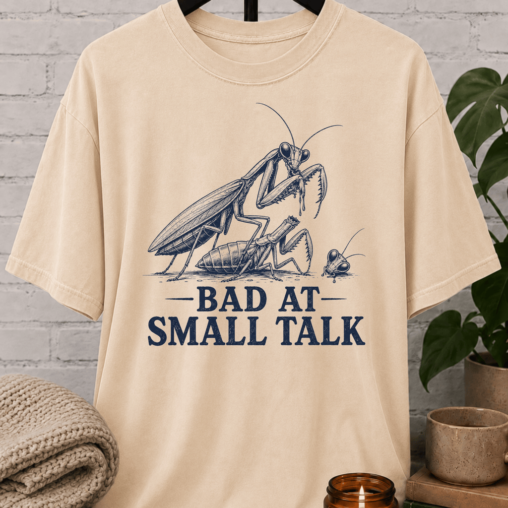 Socially awkward praying mantis T-shirt featuring two illustrated insects and the phrase “Bad at Small Talk,” a sarcastic graphic tee for awkward humor fans, quiet types, and people who hate forced conversation.