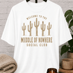 Western cactus graphic T-shirt featuring five desert cacti and the phrase “Welcome to the Middle of Nowhere Social Club,” a loner shirt for hermits, solitude lovers, and people who prefer fewer crowds.