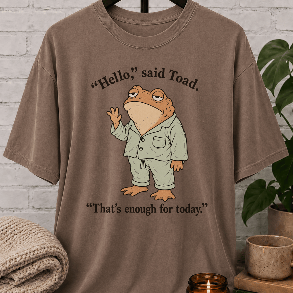 Social battery toad T-shirt featuring an unimpressed cartoon toad waving with the phrase “Hello, said Toad. That’s enough for today,” a socially drained graphic tee for awkward humor fans and people with limited social energy.