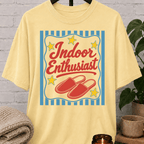 Indoor Enthusiast stay home T-shirt featuring cozy slippers, retro stars, and bold vintage artwork, an indoorsy graphic tee for people who prefer staying in and skipping plans.