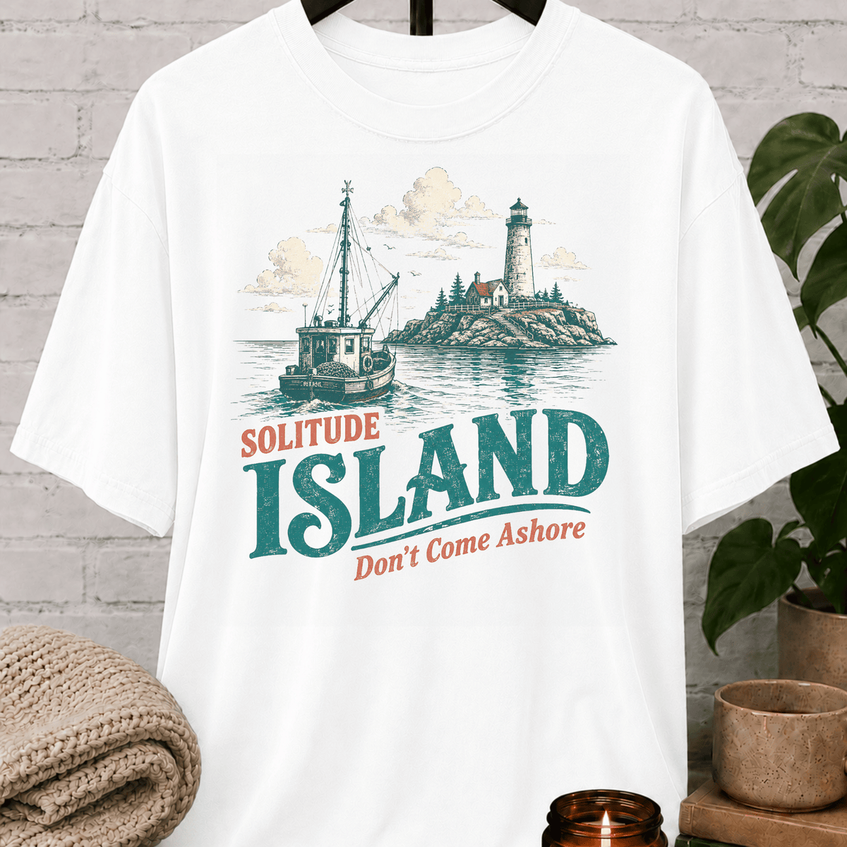 Solitude Island nautical T-shirt featuring a vintage fishing boat, lighthouse, rocky coastline, and the phrase “Don’t Come Ashore,” a loner graphic tee for solitude lovers and people who prefer being left alone.