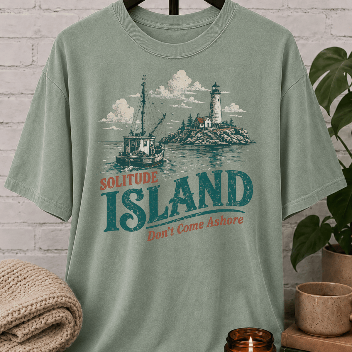 Solitude Island nautical T-shirt featuring a vintage fishing boat, lighthouse, rocky coastline, and the phrase “Don’t Come Ashore,” a loner graphic tee for solitude lovers and people who prefer being left alone.