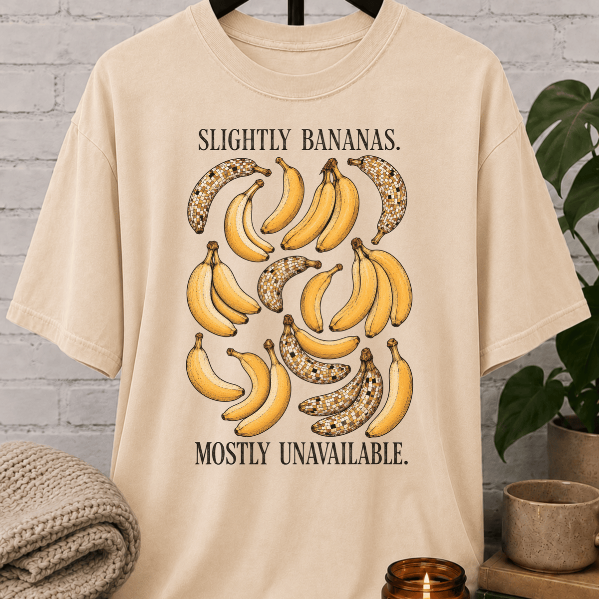 Socially unavailable banana T-shirt featuring vintage banana illustrations and the phrase “Slightly Bananas Mostly Unavailable,” a sarcastic graphic tee for loners, hermits, and people who prefer limited interaction.