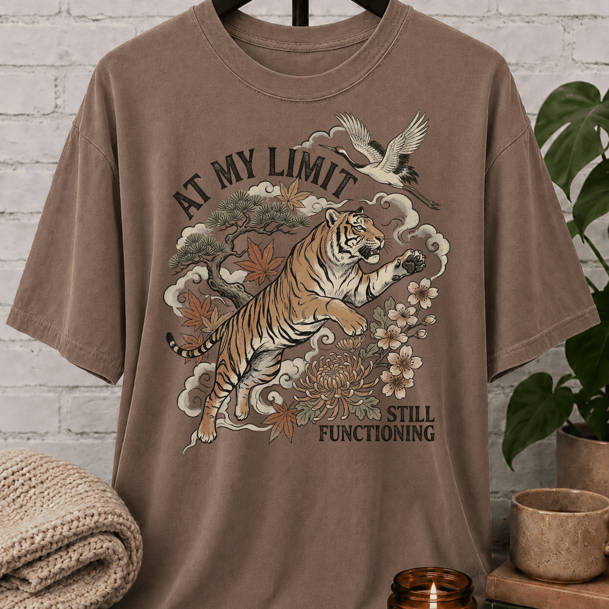 Overstimulated tiger graphic T-shirt featuring a leaping tiger with floral artwork, cranes, and the phrase “At My Limit Still Functioning,” a sarcastic graphic tee for overthinkers, overwhelmed people, and anxious humor fans.
