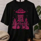 Antisocial alien UFO T-shirt featuring a pink flying saucer hovering above desert cacti with the phrase “Goodbye People Hello Peace,” a sarcastic graphic tee for loners and people who prefer solitude.