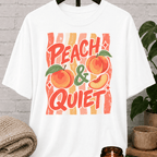 Peach and Quiet graphic T-shirt featuring retro peach illustrations and bold lettering, a peace and quiet shirt for solitude lovers, quiet types, and fans of vintage fruit graphics.