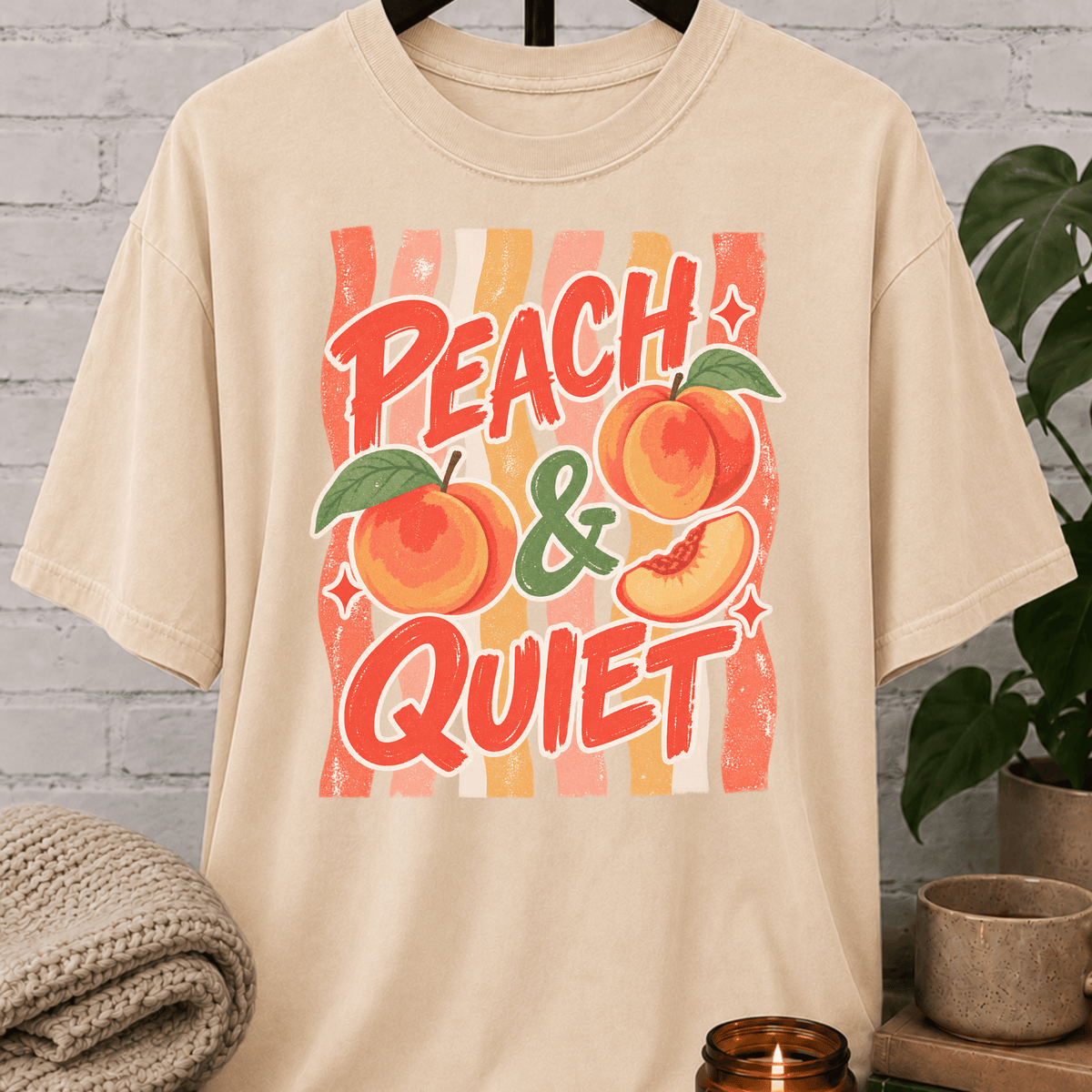 Peach and Quiet graphic T-shirt featuring retro peach illustrations and bold lettering, a peace and quiet shirt for solitude lovers, quiet types, and fans of vintage fruit graphics.