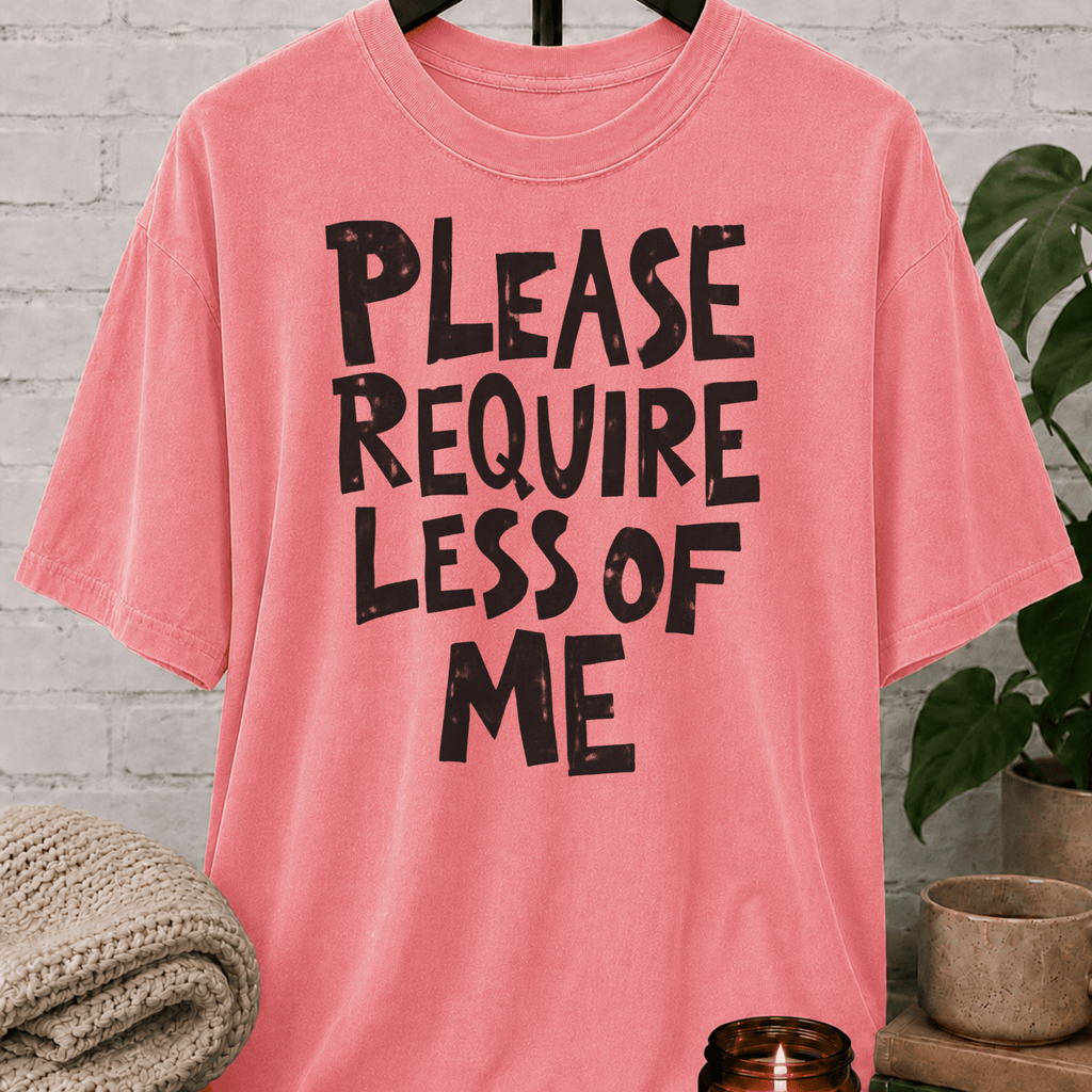 Overwhelmed humor graphic T-shirt featuring the bold phrase “Please Require Less of Me,” a sarcastic low social battery shirt for overthinkers, socially drained people, and anyone with limited bandwidth.