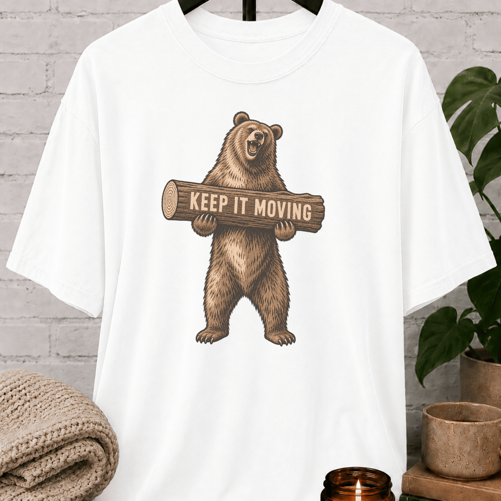 Antisocial bear graphic T-shirt featuring a standing brown bear holding a log with the phrase “Keep It Moving,” a sarcastic personal space shirt for loners, people avoiders, and fans of leave-me-alone humor.