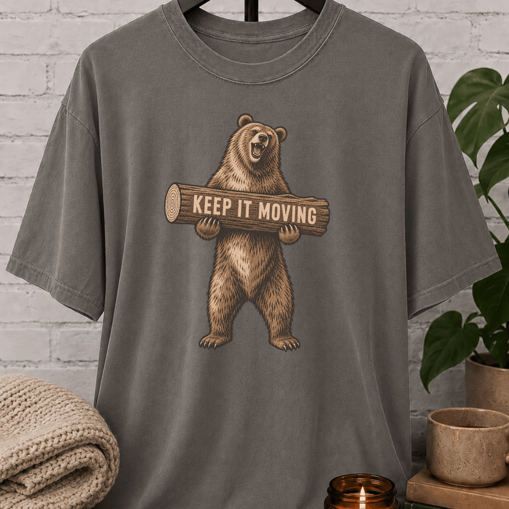 Antisocial bear graphic T-shirt featuring a standing brown bear holding a log with the phrase “Keep It Moving,” a sarcastic personal space shirt for loners, people avoiders, and fans of leave-me-alone humor.