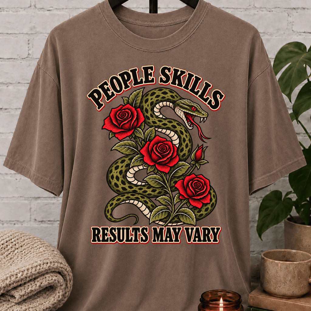 Socially awkward snake graphic T-shirt featuring a coiled green snake, red roses, and the phrase “People Skills Results May Vary,” a sarcastic graphic tee for awkward humor fans and socially selective personalities.