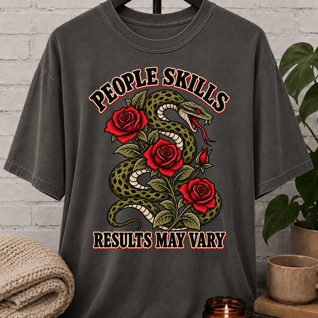 Socially awkward snake graphic T-shirt featuring a coiled green snake, red roses, and the phrase “People Skills Results May Vary,” a sarcastic graphic tee for awkward humor fans and socially selective personalities.