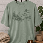 Quiet life nature graphic T-shirt featuring a mountain lake, pine trees, deer, birds, and moon with the word “Retreat,” an outdoorsy solitude shirt for people who recharge alone.