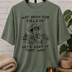 Western cowboy graphic T-shirt featuring a vintage cowboy, cactus desert scene, and the phrase “Not Much for Talkin’ Let’s Keep It That Way,” a sarcastic small talk shirt for socially selective people and conversation avoiders.