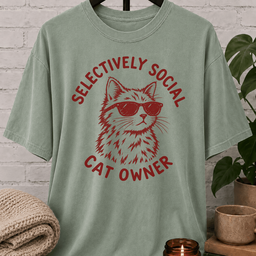Cat lover graphic T-shirt featuring a cat wearing sunglasses with the phrase “Selectively Social Cat Owner,” a sarcastic cat shirt for socially selective people, cat owners, and feline humor fans.