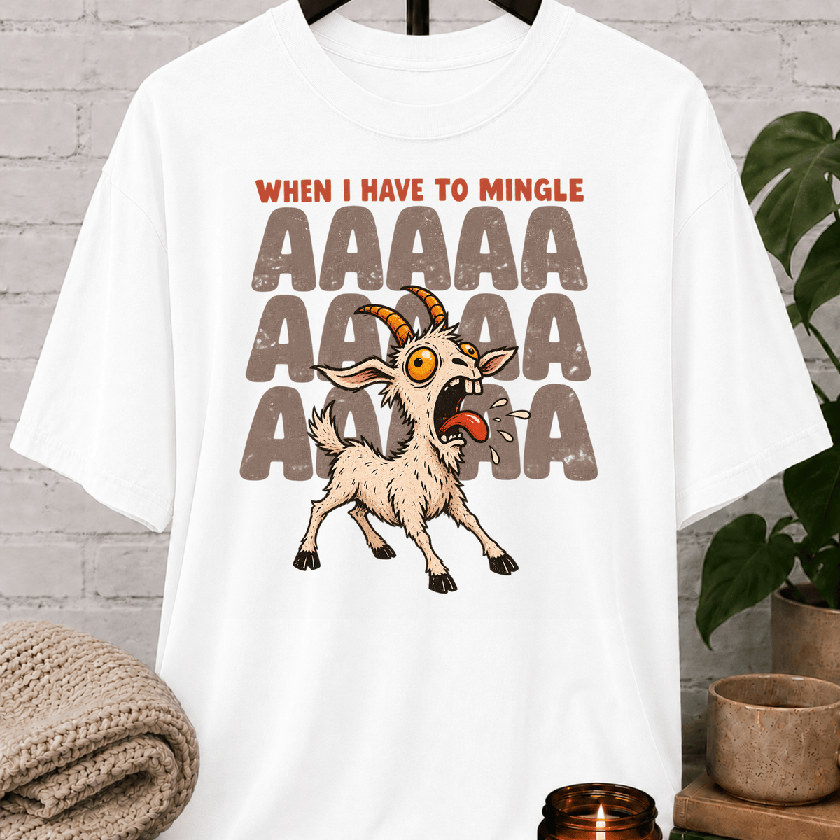 Socially awkward goat graphic T-shirt featuring a panicked screaming goat with the phrase “When I Have to Mingle,” a humorous social anxiety style shirt for reluctant minglers, awkward people, and crowd-avoidance humor fans.