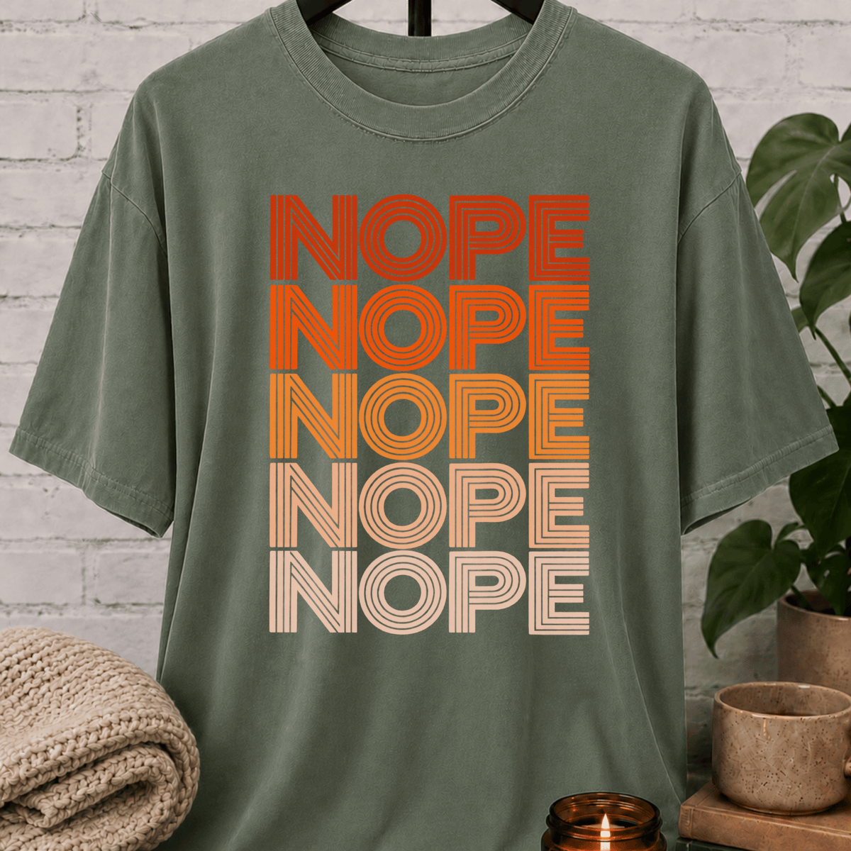 Socially selective graphic T-shirt featuring the word “NOPE” repeated five times in retro stacked lettering, a bold refusal humor shirt for plan avoiders, low social battery days, and people who prefer opting out.
