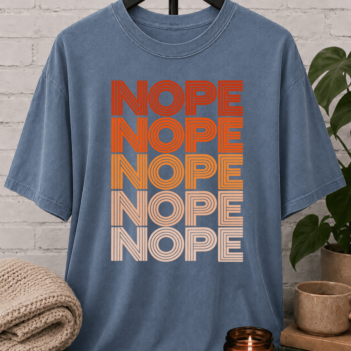 Socially selective graphic T-shirt featuring the word “NOPE” repeated five times in retro stacked lettering, a bold refusal humor shirt for plan avoiders, low social battery days, and people who prefer opting out.