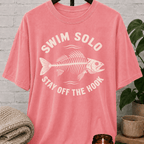 Loner fish graphic T-shirt featuring a fish skeleton with the phrase “Swim Solo Stay Off the Hook,” a sarcastic solo-life shirt for independent people, solitude lovers, and fans of people-avoidance humor.