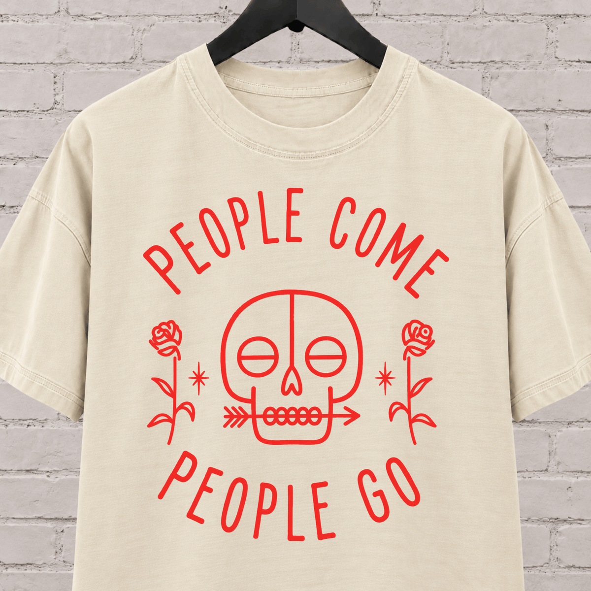 People Come People Go skull graphic T-shirt featuring a minimalist skull, roses, and arrow detail, an antisocial graphic tee for socially selective people, loners, and dark humor fans.