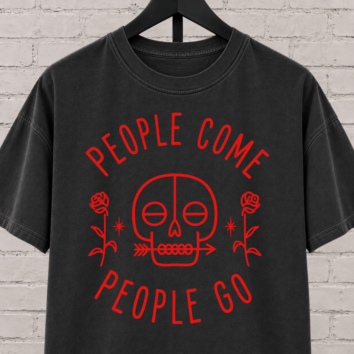 People Come People Go skull graphic T-shirt featuring a minimalist skull, roses, and arrow detail, an antisocial graphic tee for socially selective people, loners, and dark humor fans.