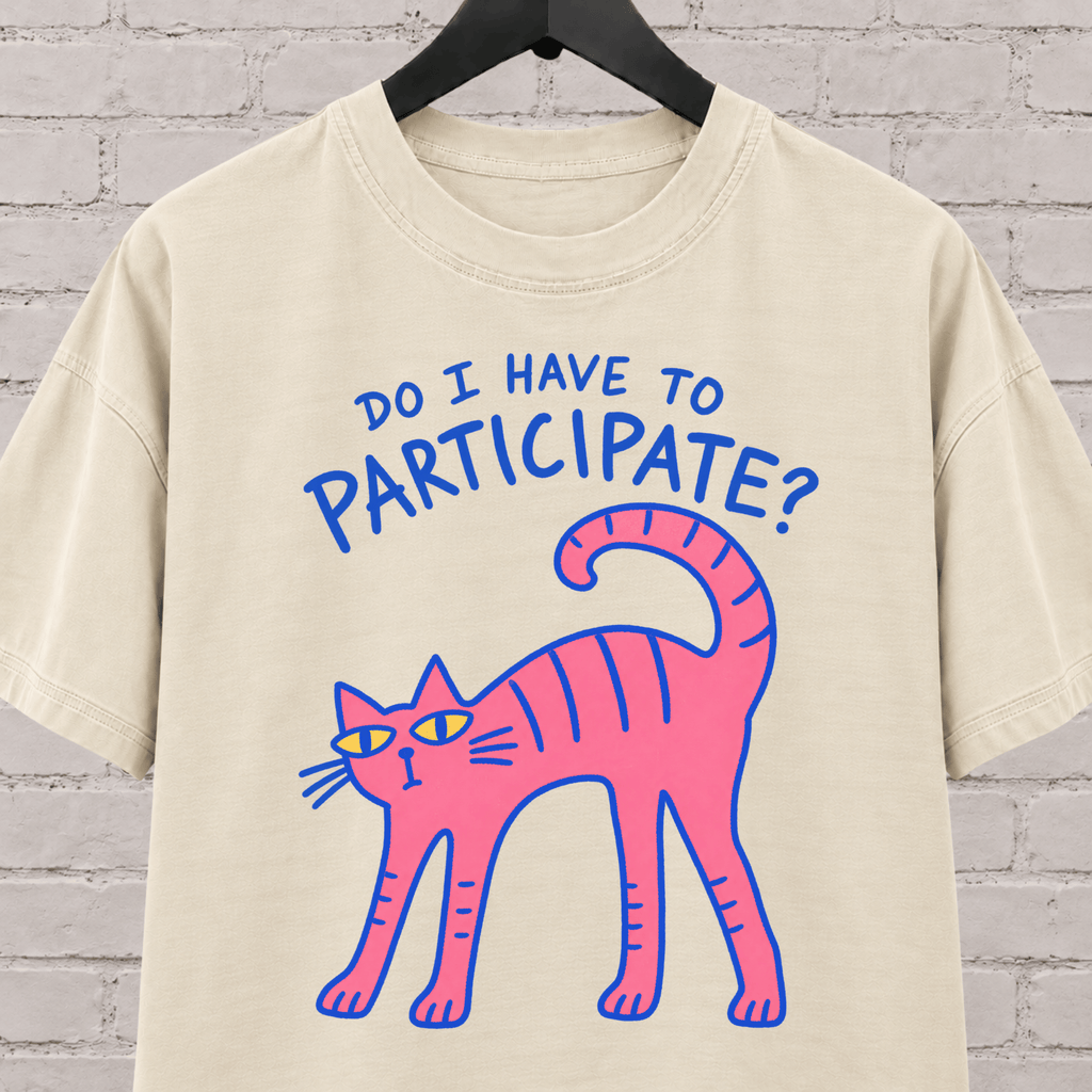 Do I Have to Participate cat graphic T-shirt featuring an unimpressed pink cat, an introvert humor shirt for reluctant socializers and group activity avoiders.
