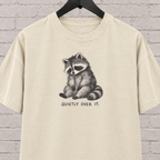 Quietly Over It raccoon graphic T-shirt featuring a tired raccoon, a low social battery shirt for socially drained people and introvert humor fans.