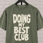 Doing My Best Club graphic T-shirt featuring bold stacked lettering, a low energy humor shirt for overwhelmed days and people running on limited bandwidth.