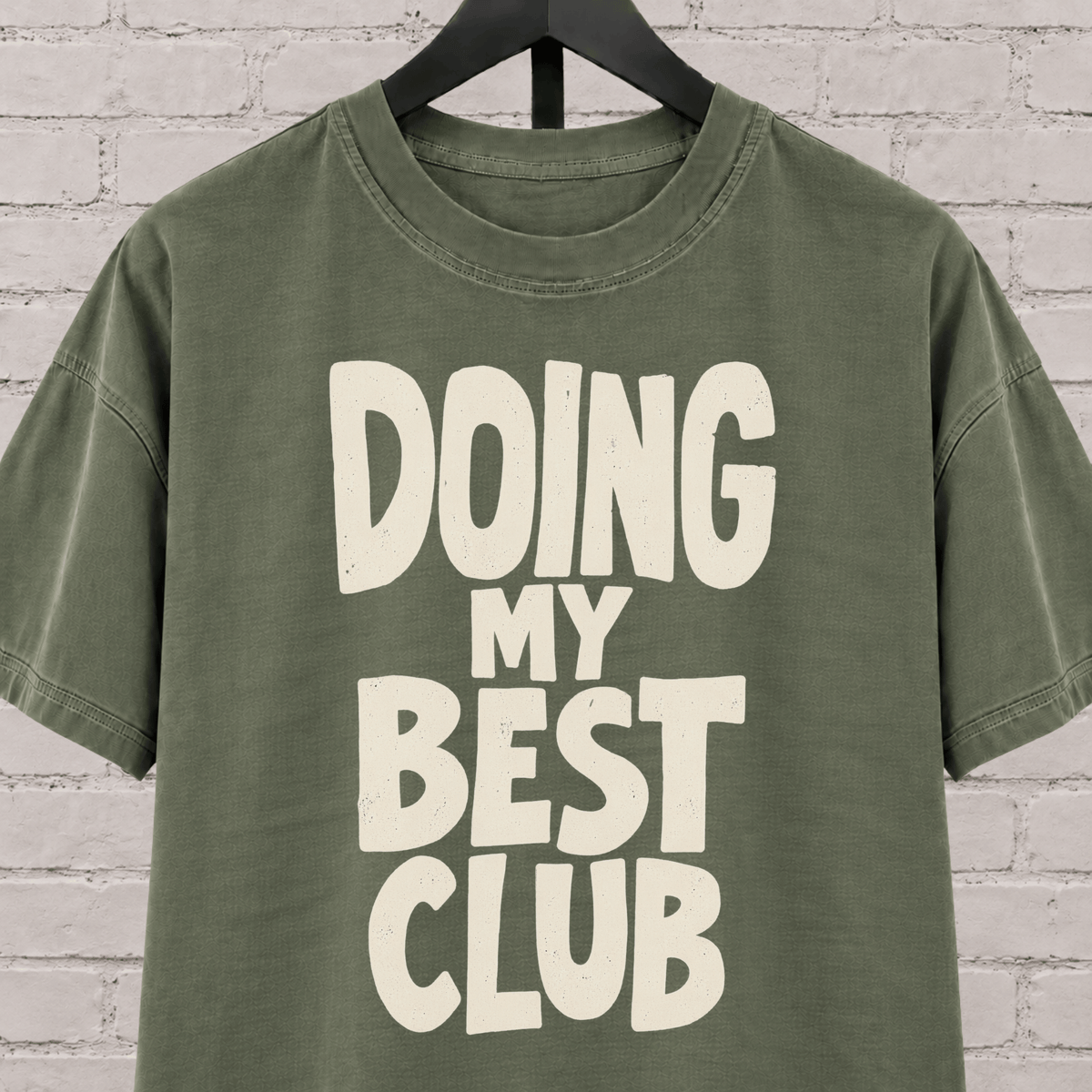 Doing My Best Club graphic T-shirt featuring bold stacked lettering, a low energy humor shirt for overwhelmed days and people running on limited bandwidth.