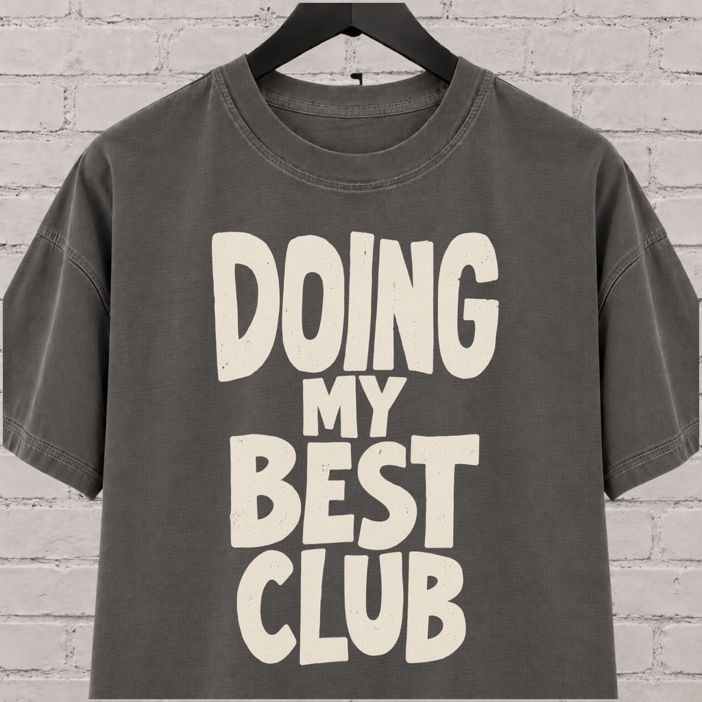 Doing My Best Club graphic T-shirt featuring bold stacked lettering, a low energy humor shirt for overwhelmed days and people running on limited bandwidth.