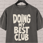 Doing My Best Club graphic T-shirt featuring bold stacked lettering, a low energy humor shirt for overwhelmed days and people running on limited bandwidth.