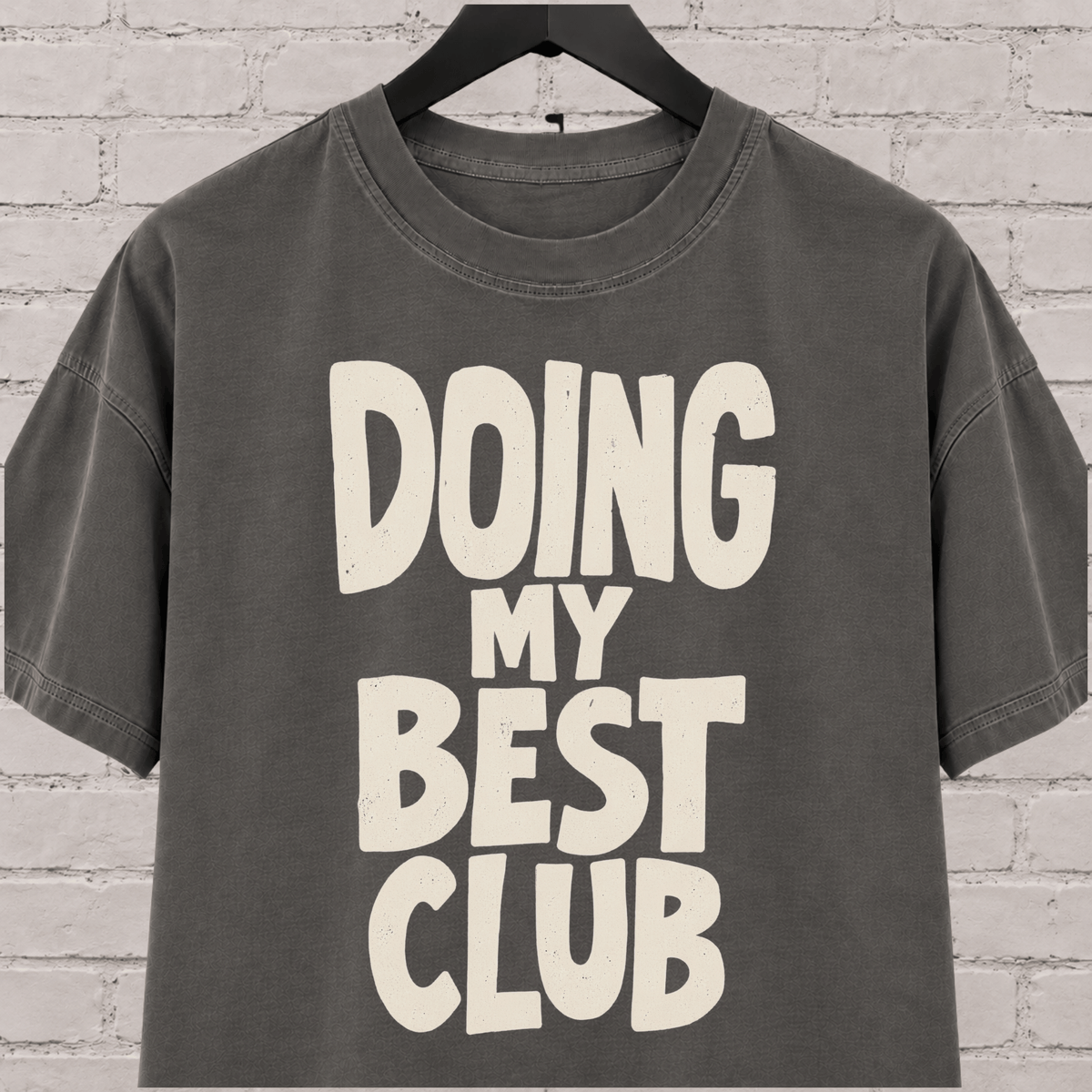 Doing My Best Club graphic T-shirt featuring bold stacked lettering, a low energy humor shirt for overwhelmed days and people running on limited bandwidth.