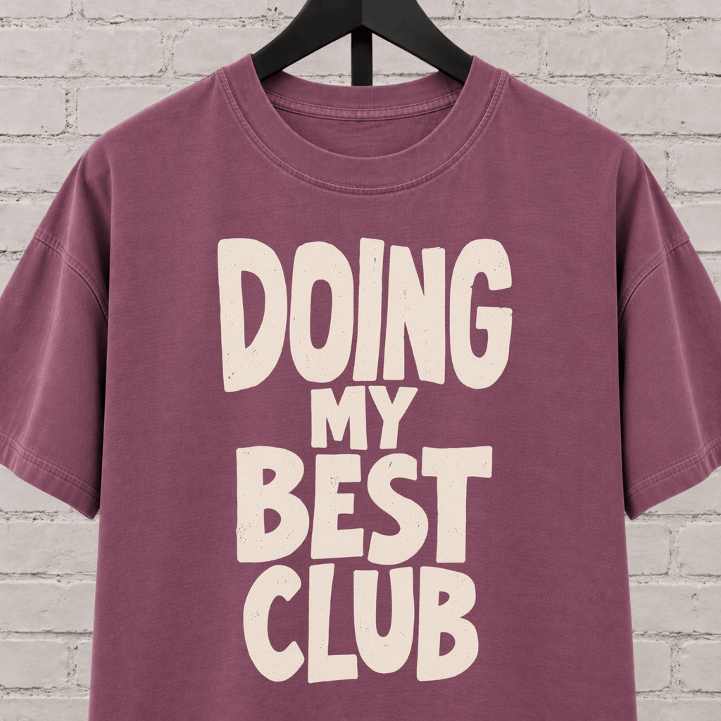 Doing My Best Club graphic T-shirt featuring bold stacked lettering, a low energy humor shirt for overwhelmed days and people running on limited bandwidth.