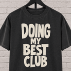 Doing My Best Club graphic T-shirt featuring bold stacked lettering, a low energy humor shirt for overwhelmed days and people running on limited bandwidth.