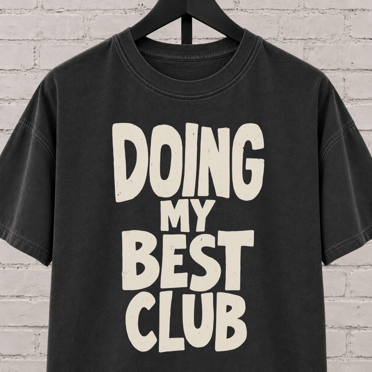 Doing My Best Club graphic T-shirt featuring bold stacked lettering, a low energy humor shirt for overwhelmed days and people running on limited bandwidth.