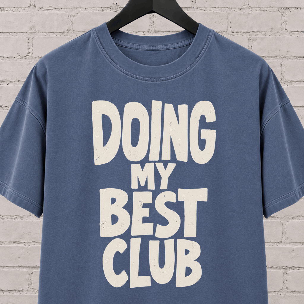 Doing My Best Club graphic T-shirt featuring bold stacked lettering, a low energy humor shirt for overwhelmed days and people running on limited bandwidth.