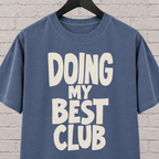 Doing My Best Club graphic T-shirt featuring bold stacked lettering, a low energy humor shirt for overwhelmed days and people running on limited bandwidth.